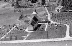 Helgen kirke med kirkegrd 1958 
Helgen church and churchyard 1958.