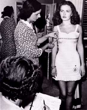 Jeanne Crain being fitted for a dress