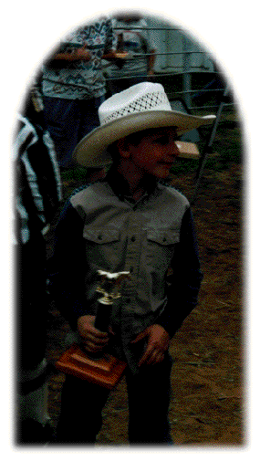 Brandon, very happy with his trophy, also Brandon is the 2001 All Around Cowboy
