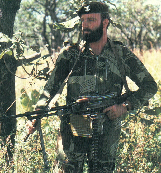 Selous Scout with Russian light machine gun. Note camouflage and beard.