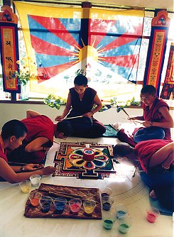 The nuns at work on a sand mandala in Oakland