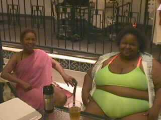 Image: Two woman by the pool