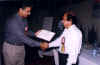 Principal IIEE receiving certificate from Chairman IEEE Karachi Branch (18260 bytes)