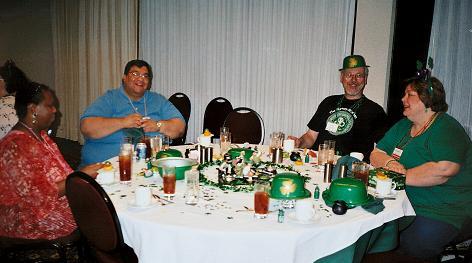 Image: People at table decorated for St. Patrick's day.