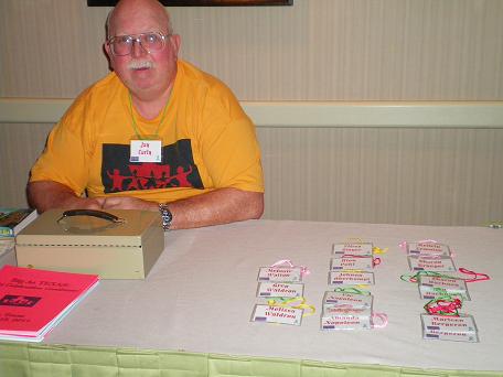 Image: man at registration table.
